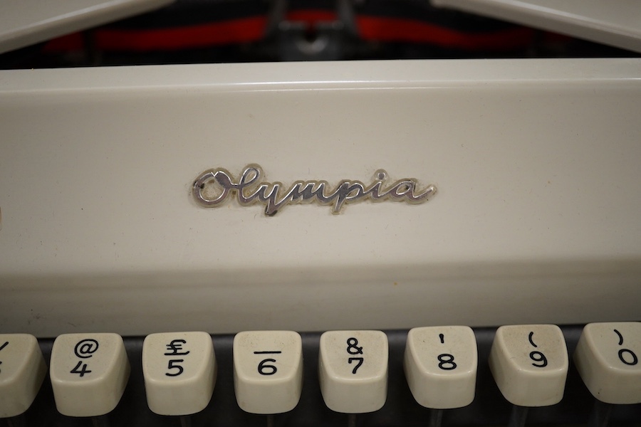 An Olympia typewriter and two 1960s slide viewers, typewriter 37cm x 35cm. Condition - untested if in working order.